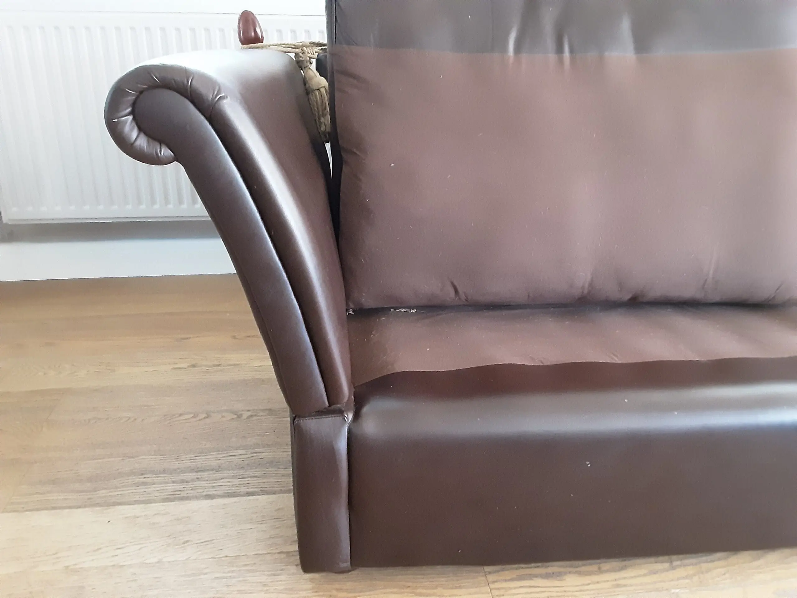 A PAIR OF LARGE LAURA ASHLEY LEATHER SOFAS in BROWN