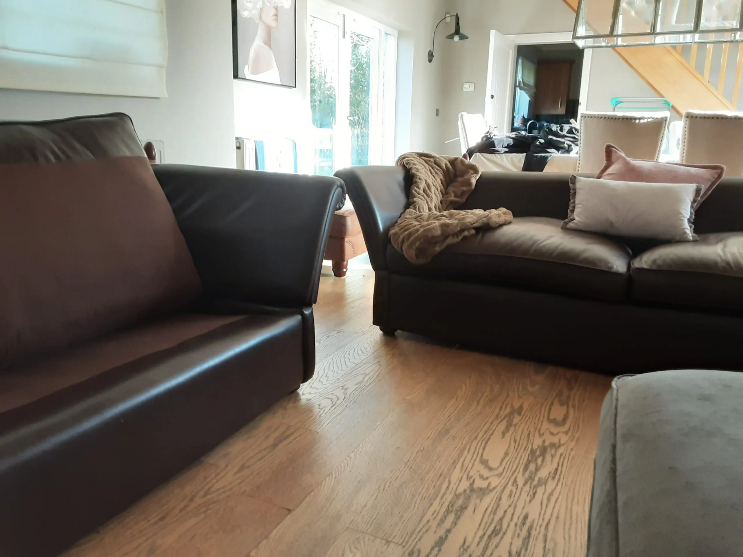 A PAIR OF LARGE LAURA ASHLEY LEATHER SOFAS in BROWN