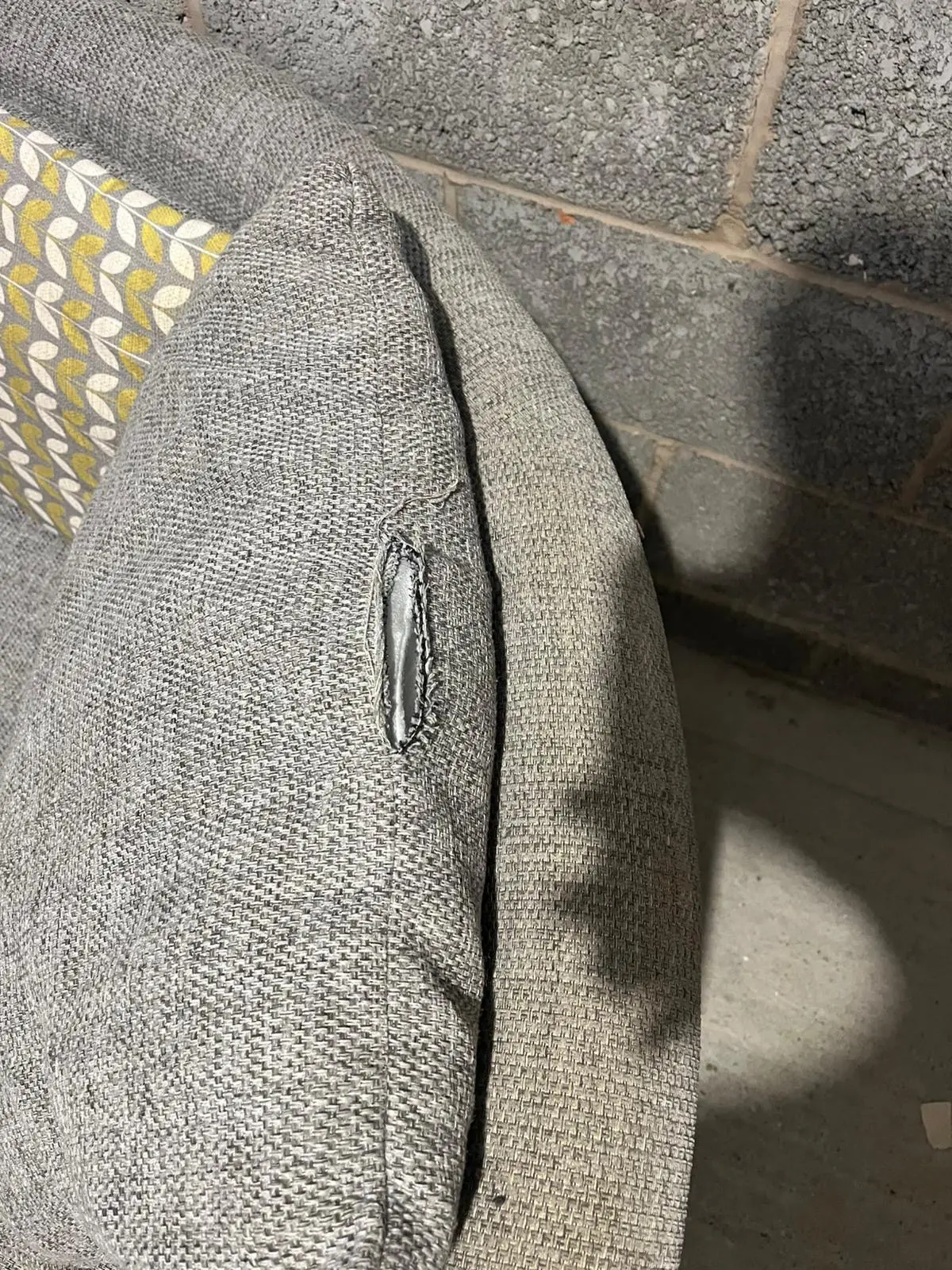 Grey DFS bay window -style sofa with thro pillows