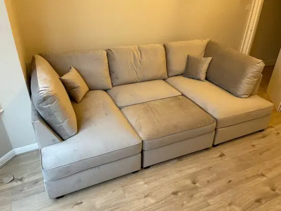 U-shaped corner sofa with footstool