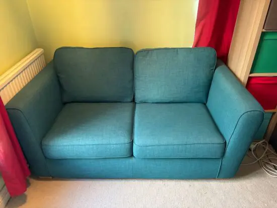 SCS 2 seater sofa bed in a teal green