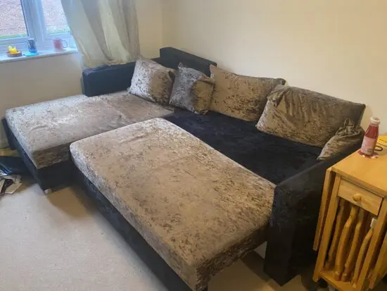 Bespoke, light brown and black, corner sofa with built in sofa bed and storage