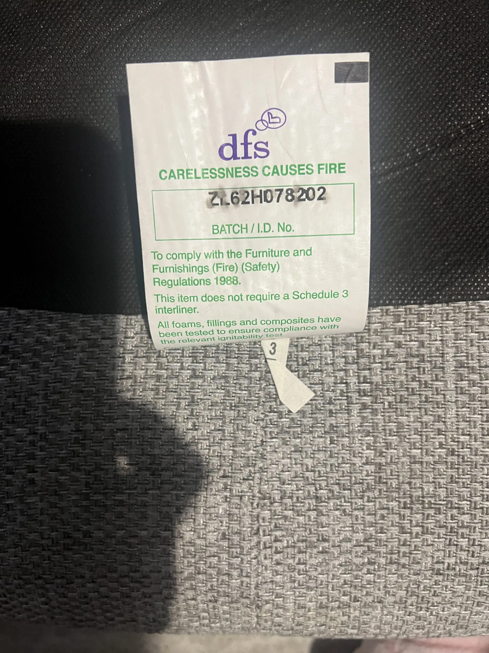 Grey DFS bay window -style sofa with thro pillows