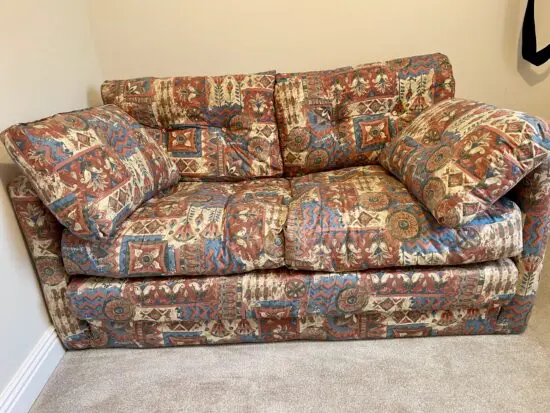 Stylish cushioned sofa bed used once