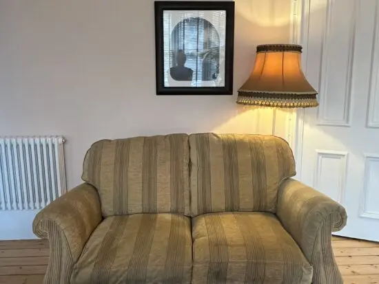 Pair of Parker Knoll Gold Ticking Striped Two Seater Sofas with Wooden legs and castors