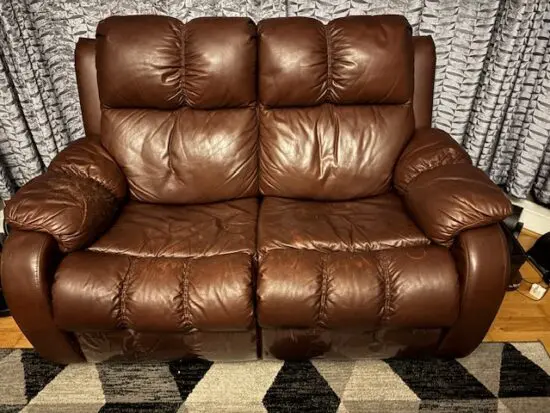 Two seater leather electric recliner sofa