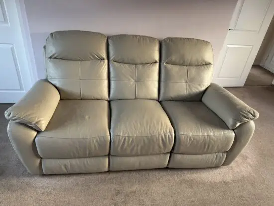 Cream leather 3 seater recliner located in Aylesbury