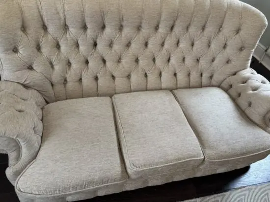 Beige/cream three seater antique chesterfield sofa - re upholstered