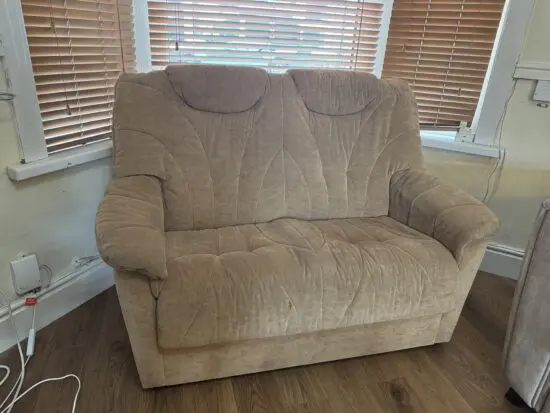 Tan two seater sofa