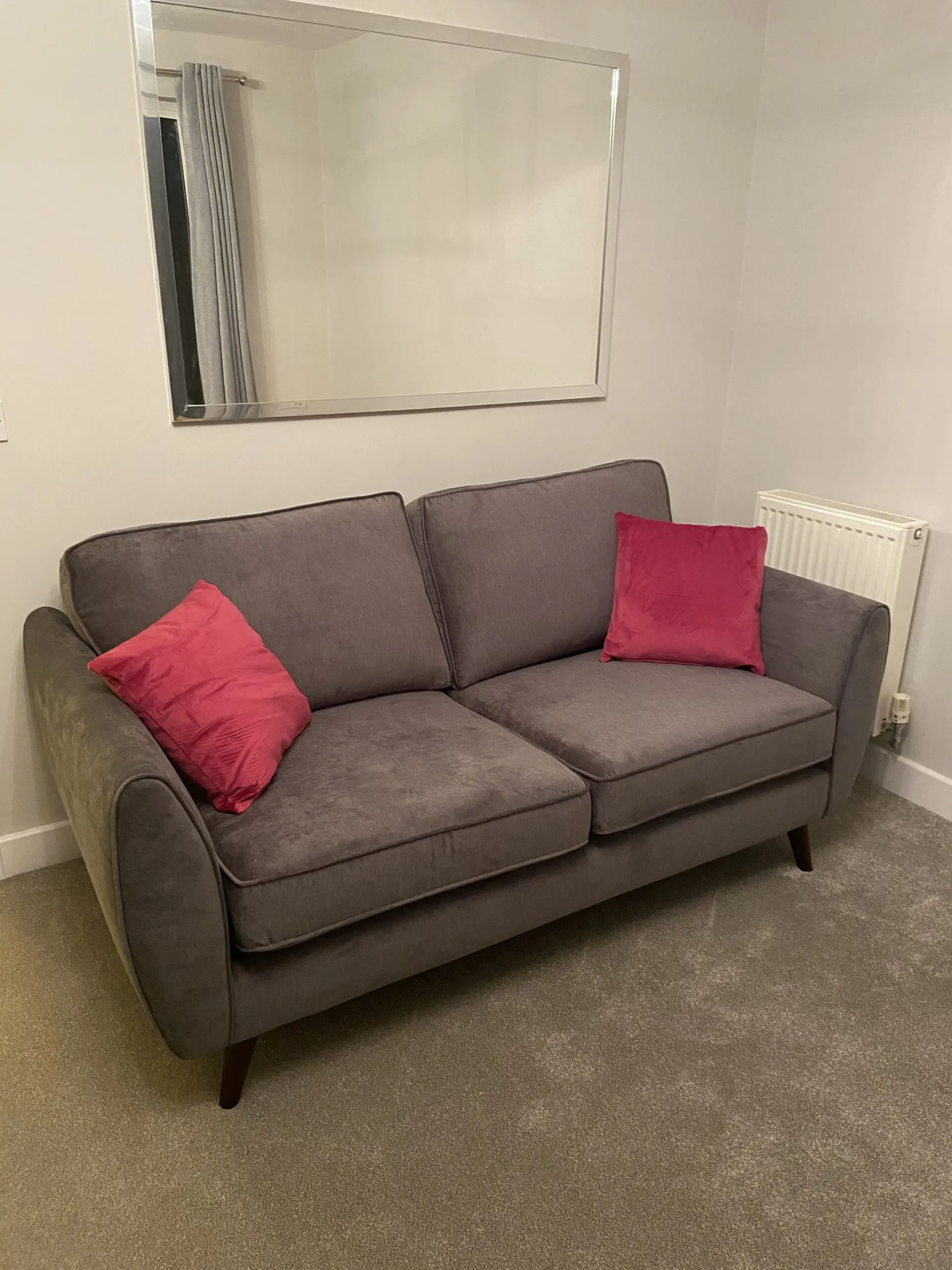 2 DFS charcoal grey Kyra 3-seater sofas with complementary footstool