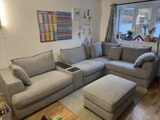 DFS Rowe Cinema sound corner sofa with two foot stools.