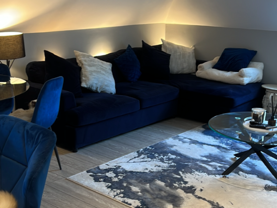 Navy corner sofa with foot stall