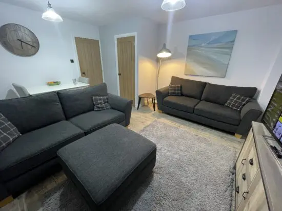 Two large sofas in charcoal