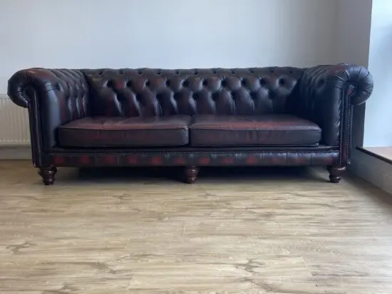 Distinctive Oxblood Chesterfield : Three Seater Leather Sofa.