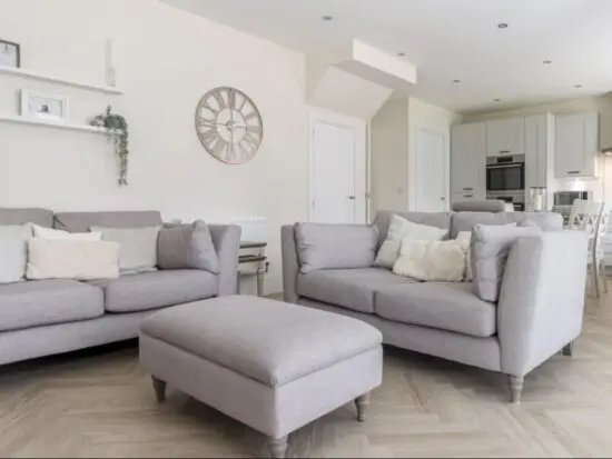 DFS 2 x 2 seaters sofas and matching footstool in grey