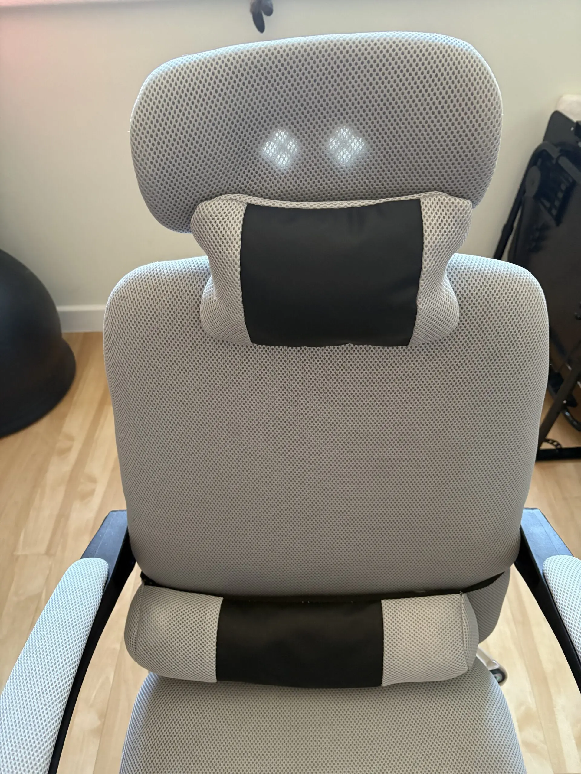 Ergonomic Chair with padded arms and silver metal base with footrest light grey