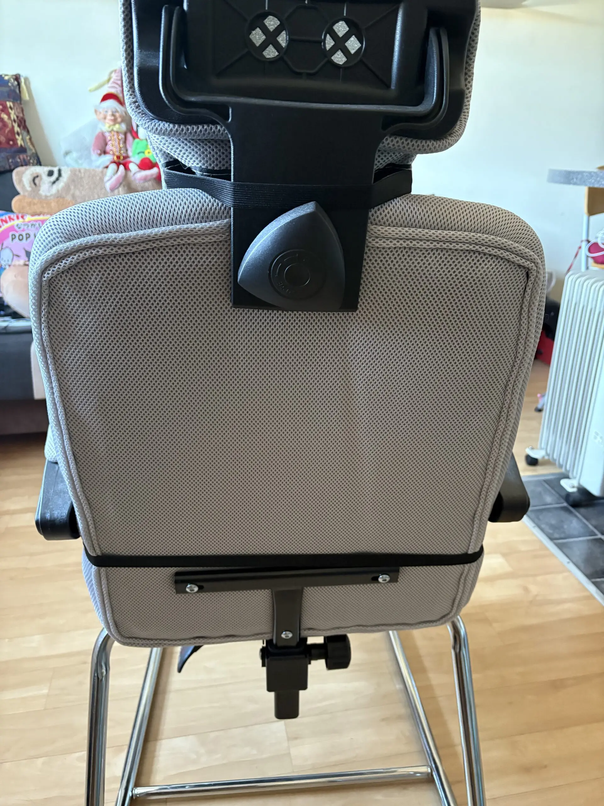 Ergonomic Chair with padded arms and silver metal base with footrest light grey