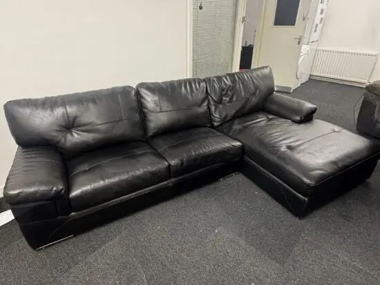 Black corner leather sofa with chase