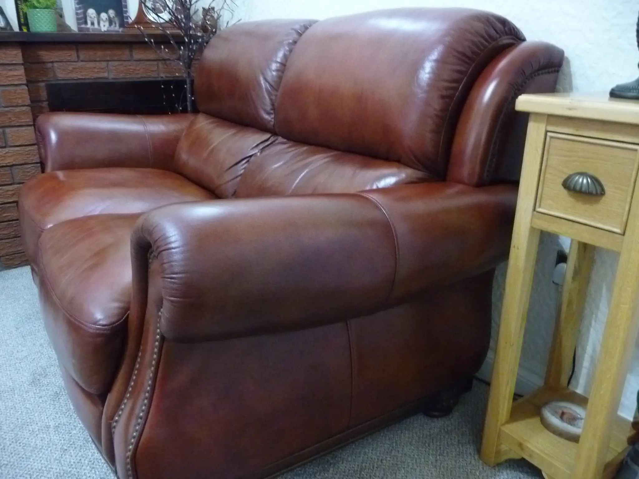 Quality leather 2 seater dark tan sofa and single chair.