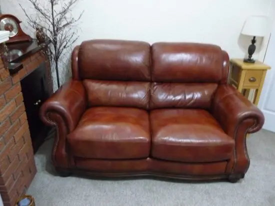 Quality leather 2 seater dark tan sofa and single chair.