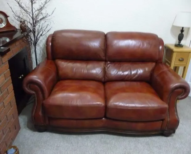 Quality leather 2 seater dark tan sofa and single chair.