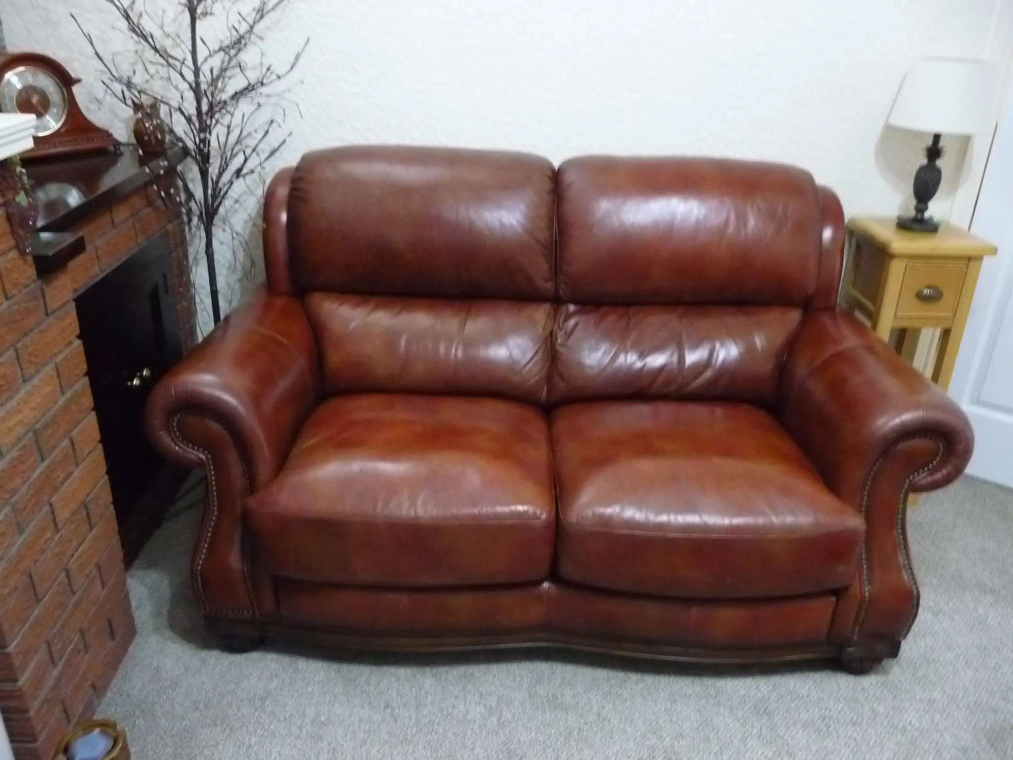 Quality leather 2 seater dark tan sofa and single chair.