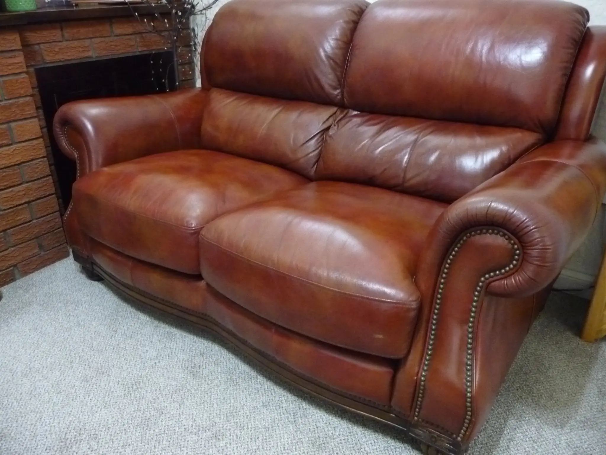 Quality leather 2 seater dark tan sofa and single chair.