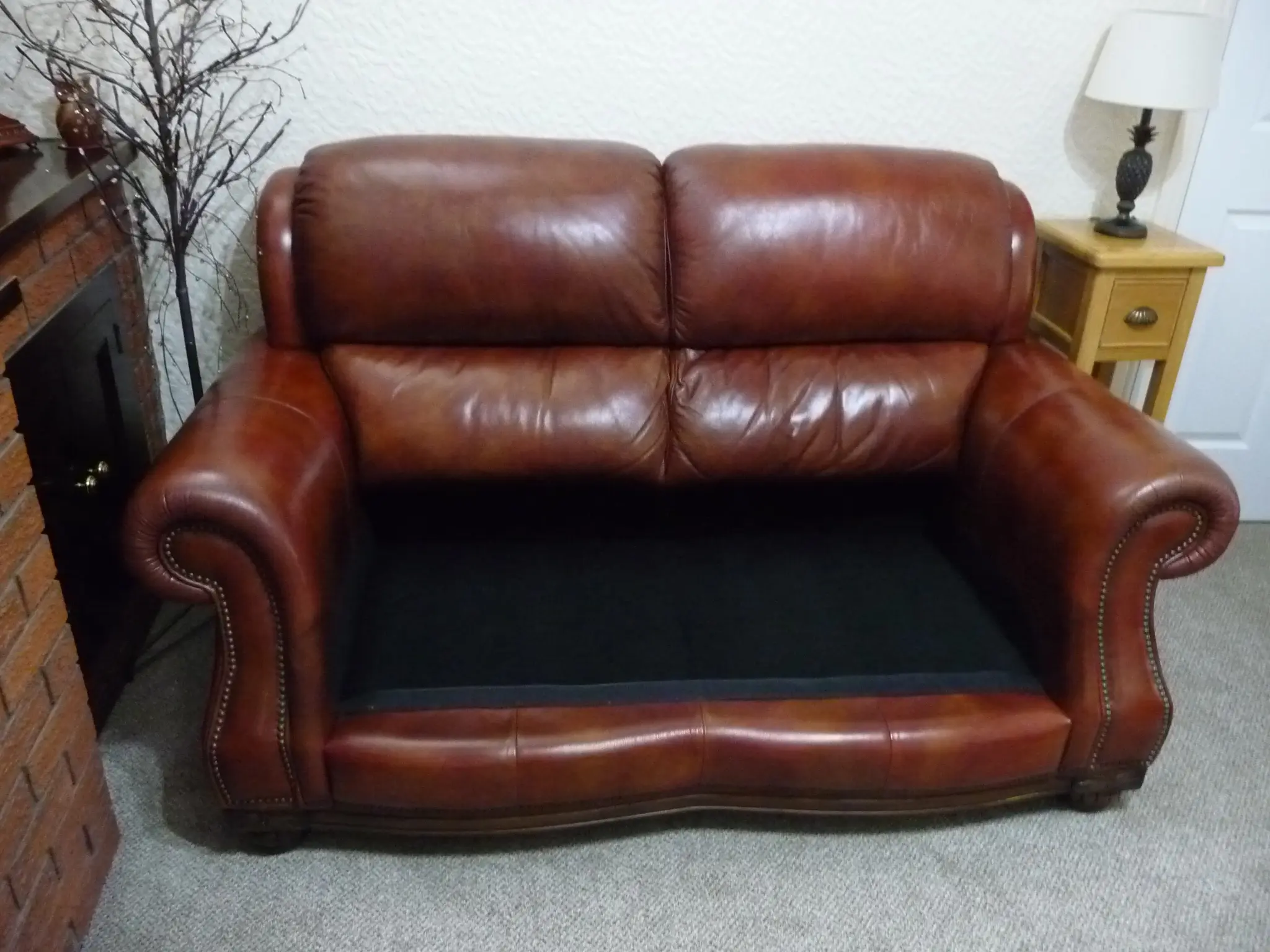 Quality leather 2 seater dark tan sofa and single chair.