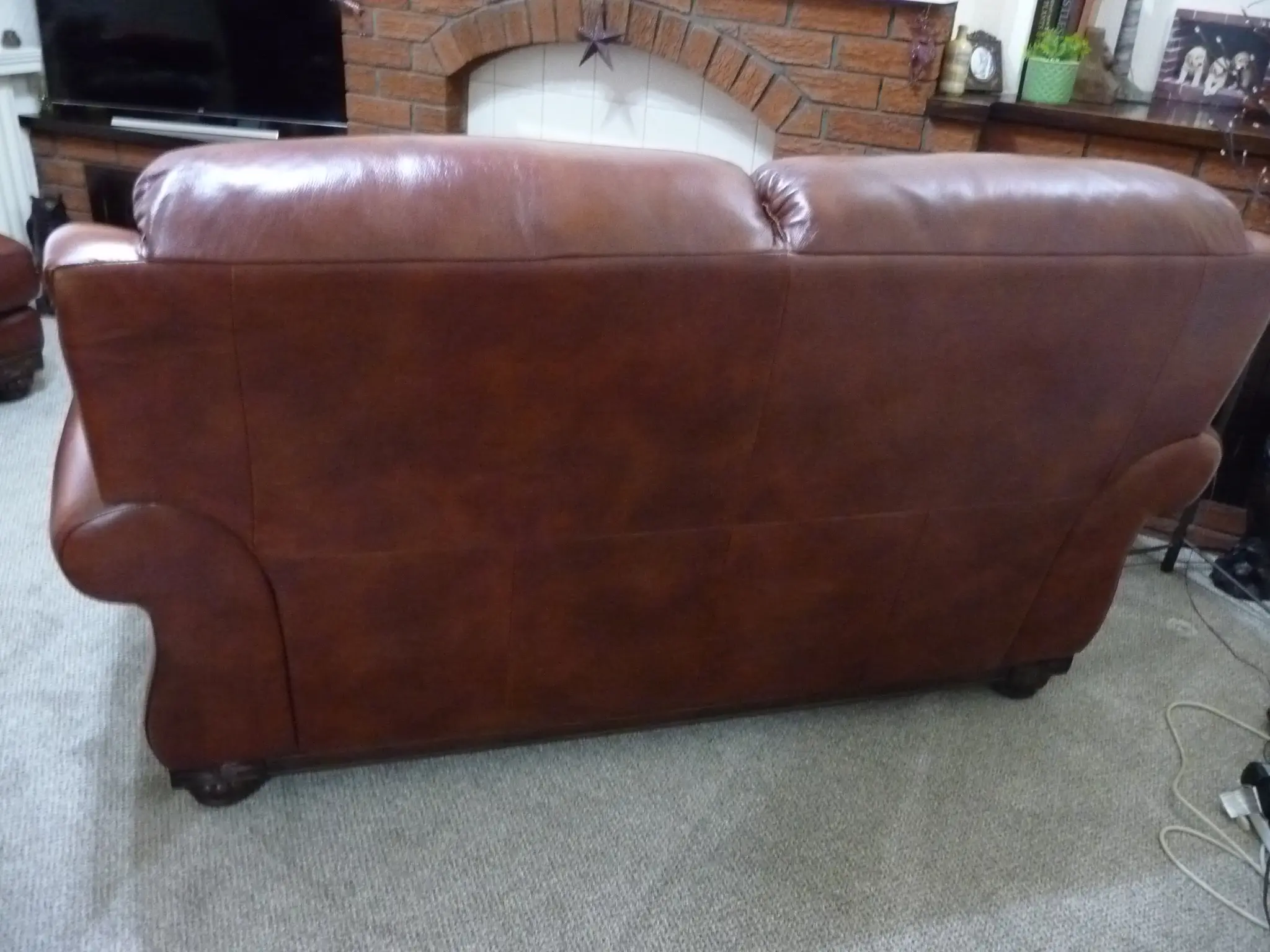 Quality leather 2 seater dark tan sofa and single chair.