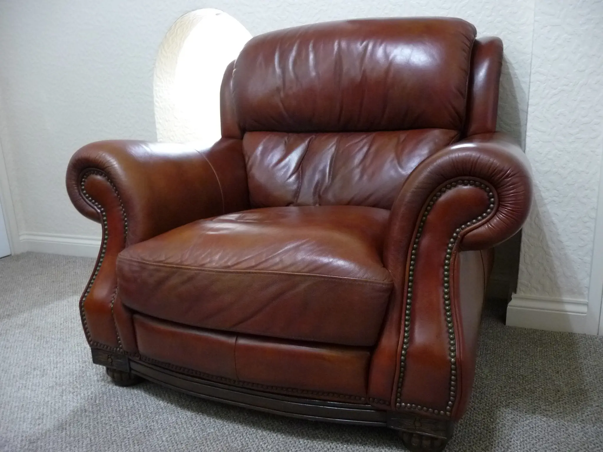 Quality leather 2 seater dark tan sofa and single chair.