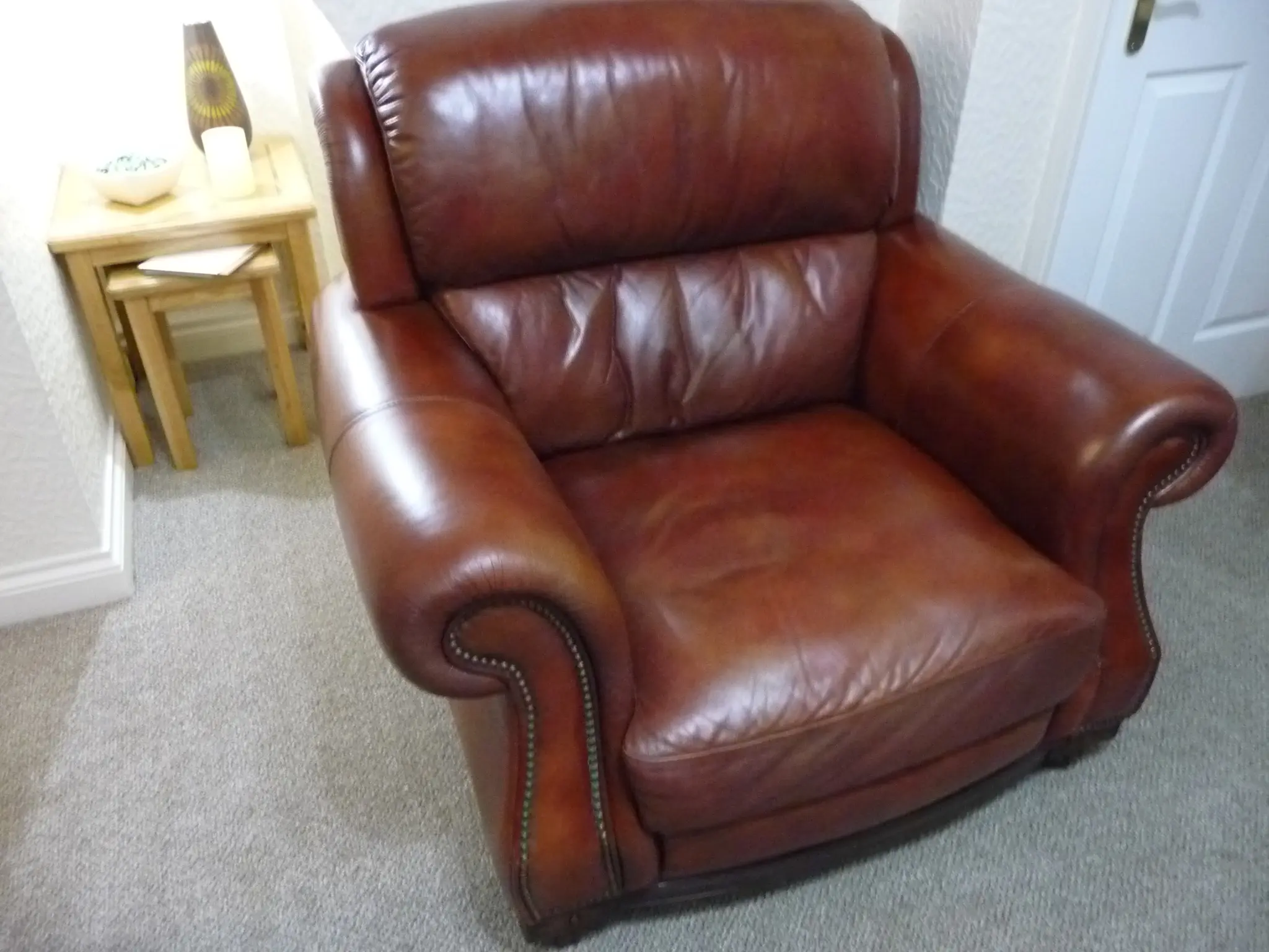Quality leather 2 seater dark tan sofa and single chair.