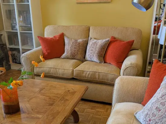 TWO PARKER KNOLL SOFAS IN PLAIN GOLD CHENILLE FABRIC