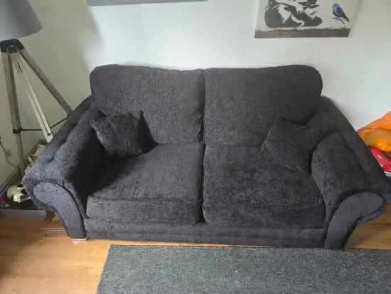 Black 3 seater and cuddle chair