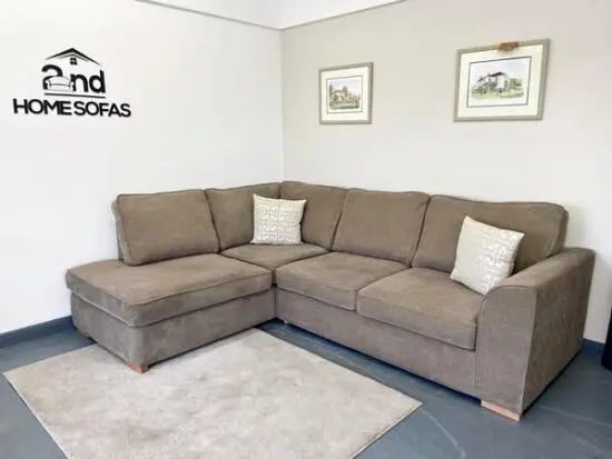 DFS 4 Seater Corner Sofa With High Back Pillows In Beige/Brown Color For Sale