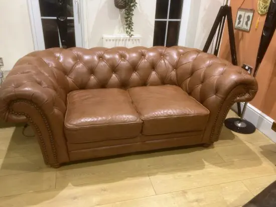 DFS tan leather 2 seater chesterfield sofa