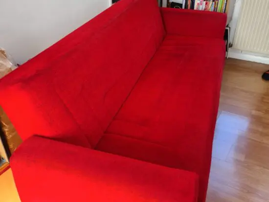 Red fabric sofabed with storage