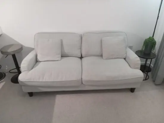 Light grey 3 seater sofa with 2 cushions