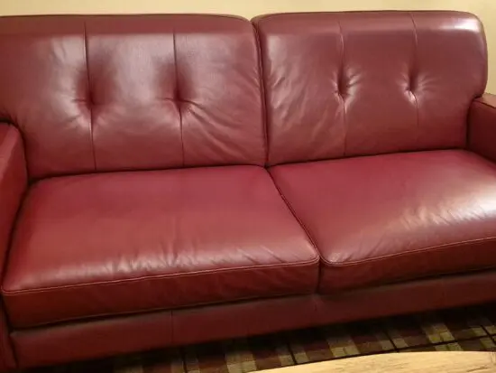 2 Red three seated couches
