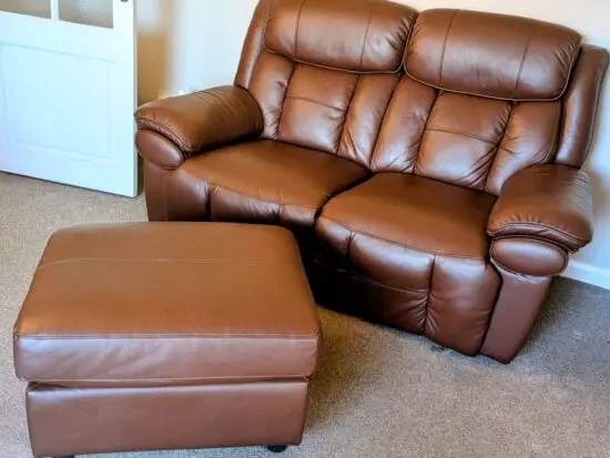 DFS 3 and 2 seater brown leather sofas and 1 matching footstool