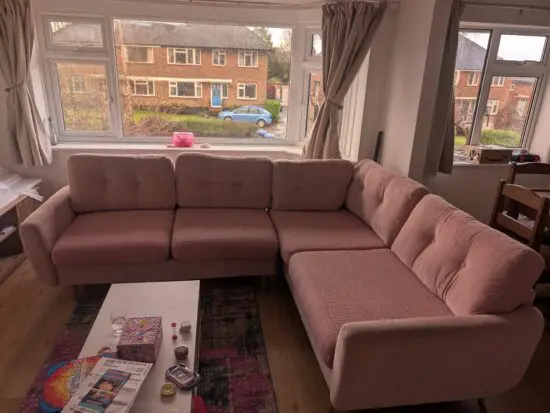 Light pink corner sofabed