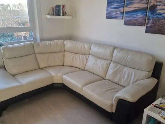 Leather DFS, cream and black corner sofa and electric recliner chair