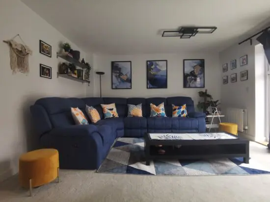 Moreno Fabric corner sofa in blue with power recliners on both ends