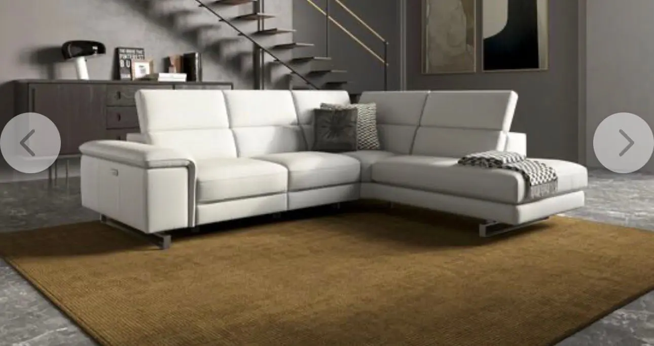 Brand new SCS Leather corner recliner sofa in light grey macadamia 830- trim stainless steel feet. Also footstool.Please see photos for the colour macadamia and the measurements of the sofa. (Open to sensible offers)