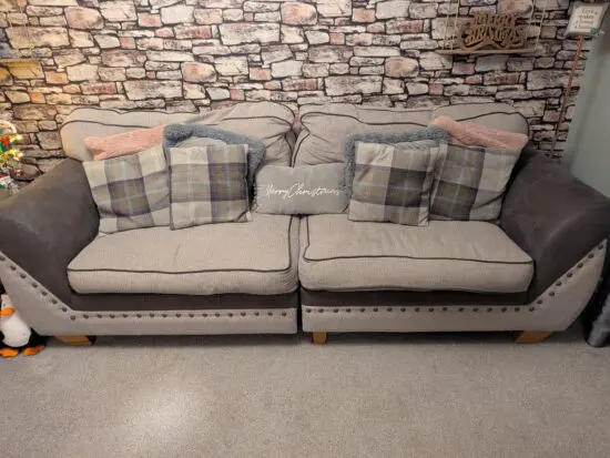 Grey and brown SCS 4 seater sofa, two arm chairs and foot stall