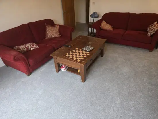 Pair of red fabric two seater Multiyork sofas