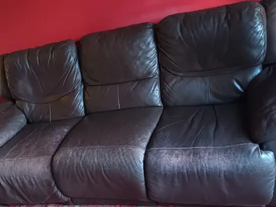 Two Jasmine brown leather recliner sofas .