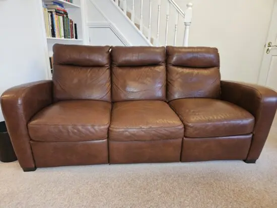 Natuzzi Group Ital Leather Sofa and chairs in dark brown.