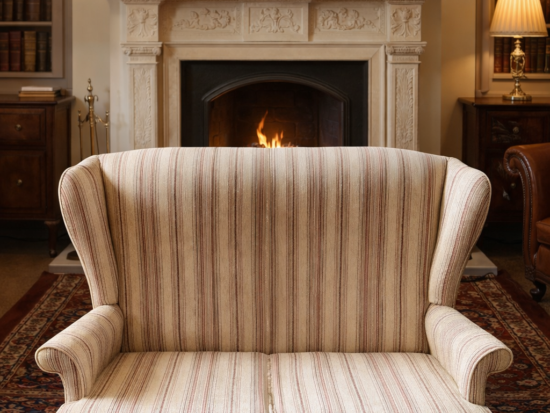 A classic Parker Knoll two-seater in a traditional wingback