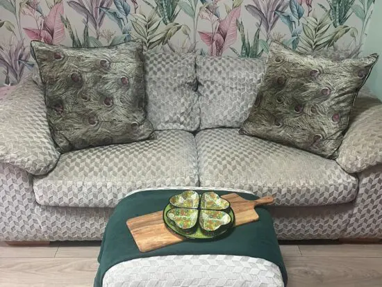 Grey patterned 3 seater sofa with matching foot stall /pouffe