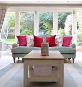 2 lovely Laura Ashley Lynden velvet looking green 3 seater sofas and matching pouf